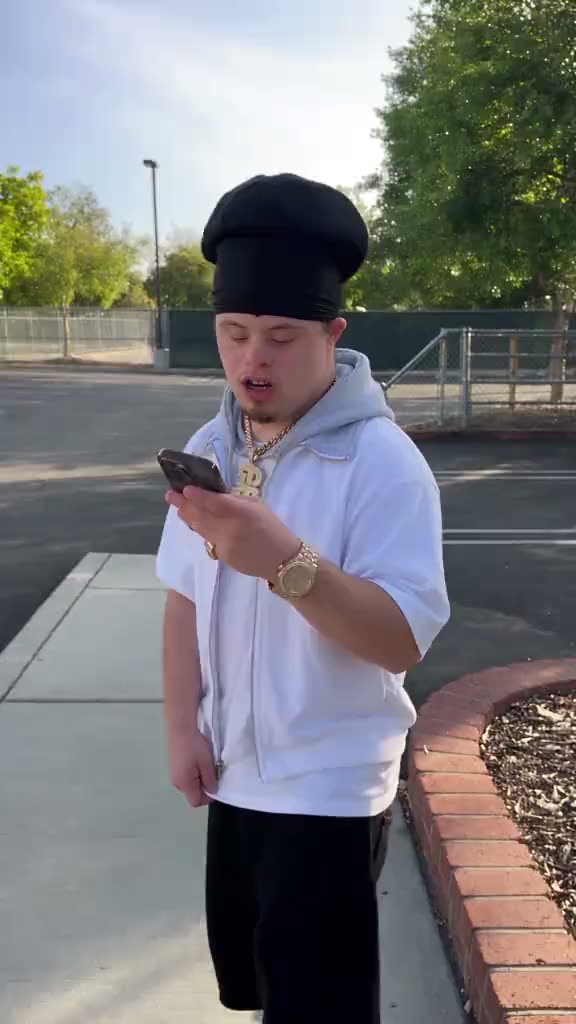 Person in a white hoodie checking a phone outdoors | ChatGPT Millionaire AI Video Generator